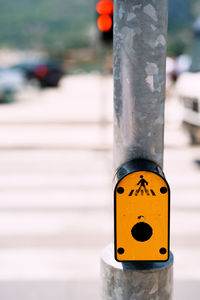 Close-up of yellow telephone pole