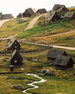 Mountain cottages on field