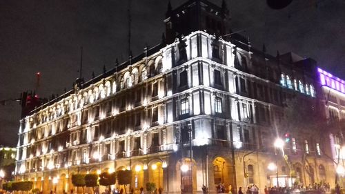 Low angle view of illuminated building at night