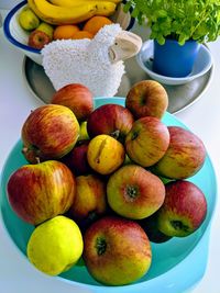 High angle view of apples in container on table