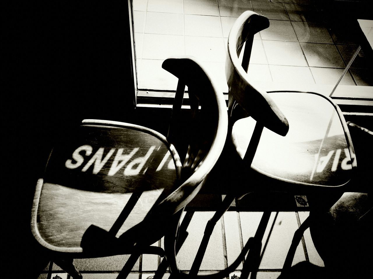 indoors, table, communication, close-up, no people, chair, still life, text, western script, reflection, empty, technology, absence, day, sunlight, shadow, cafe, retro styled, coffee cup, seat