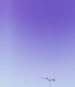 Low angle view of antenna against clear sky