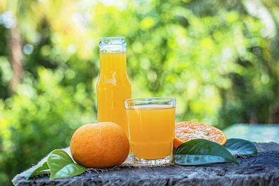 Close-up of orange juice on table