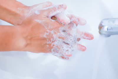 Close-up of hand holding ice cream