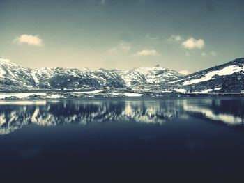 Scenic view of lake with mountains in background