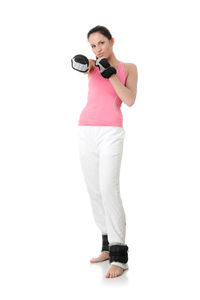 Portrait of young woman standing against white background