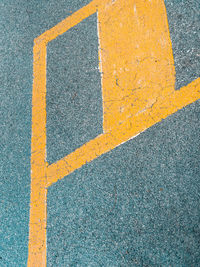 High angle view of yellow road marking