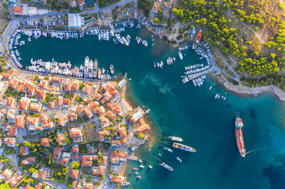 High angle view of buildings by sea