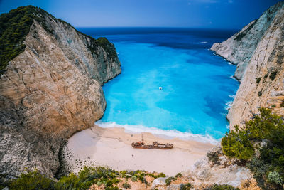 Aerial view of abandoned ship at beach