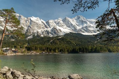 Scenic view of lake and mountains against sky