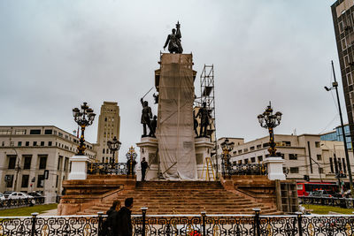 Low angle view of statue against sky