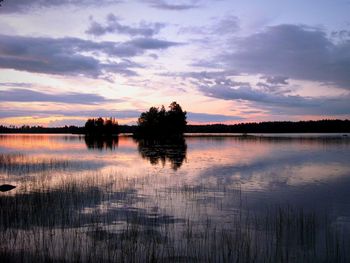 Scenic view of lake against sky during sunset