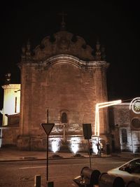 Illuminated buildings in city at night