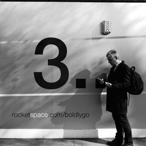 Full length of man standing against wall