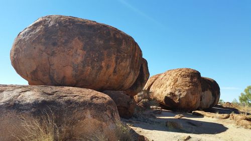 Rock formation against clear blue sky