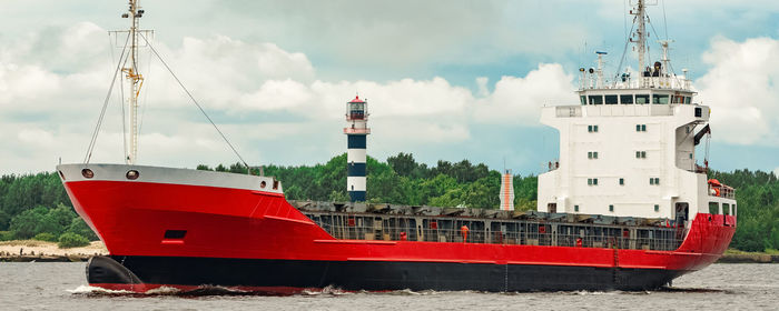 Ship moored on sea against sky