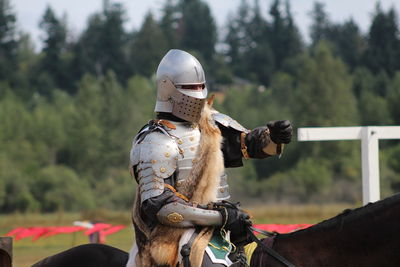 Man feeding horse