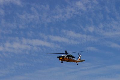 Low angle view of airplane flying in sky