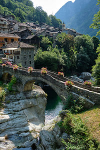 Bridge over river amidst mountains