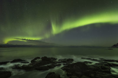 Scenic view of sea against sky at night