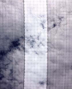 Close-up of human eye against the sky