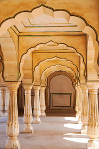 Columned hall of amber fort in jaipur ,india with shade of sunlight