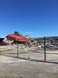 Construction site against clear blue sky