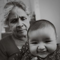 Portrait of cute baby girl with grandmother