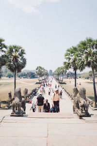 Group of people on sidewalk in city