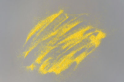 High angle view of yellow painting on background