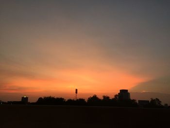 Silhouette of built structures at sunset