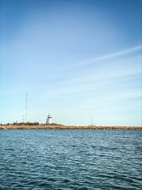 Scenic view of sea against blue sky