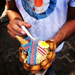 Midsection of woman holding food