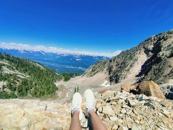 Low section of woman against mountain