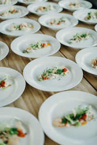 High angle view of food served in plates on table at wedding ceremony