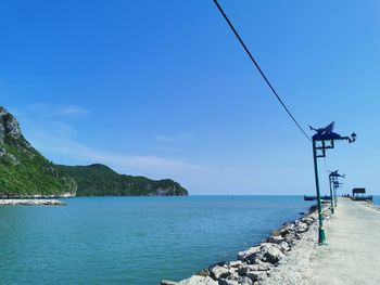 Scenic view of sea against blue sky