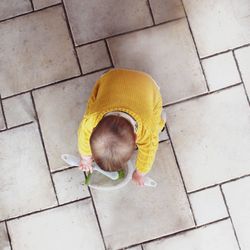 High angle view of child on footpath