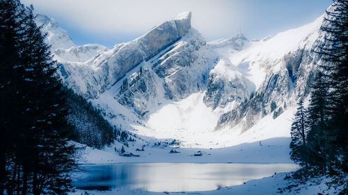 Scenic view of snowcapped mountains against sky