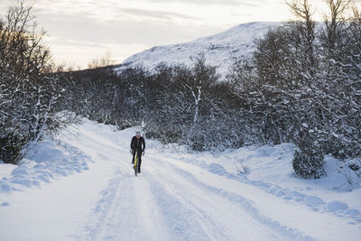 Man cycling at winter