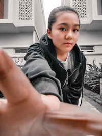 Portrait of friends sitting on table