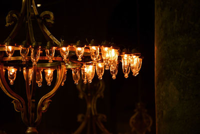 Close-up of illuminated light candles in the dark