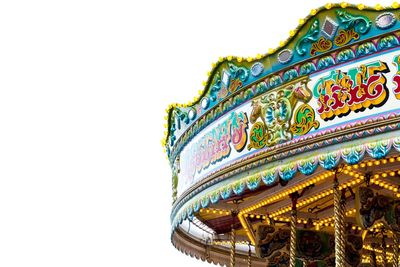 Low angle view of carousel against clear sky