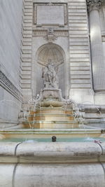 Low angle view of fountain against building