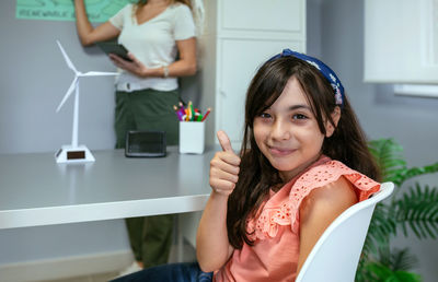 Portrait of young woman using mobile phone