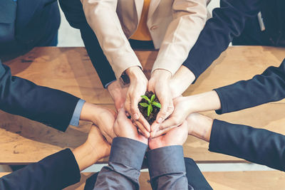 High angle view of people holding hands