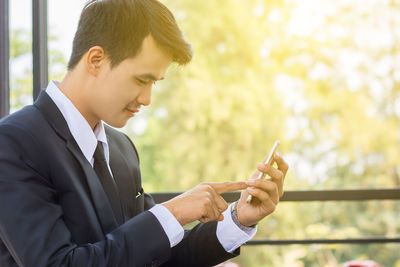 Young man using mobile phone