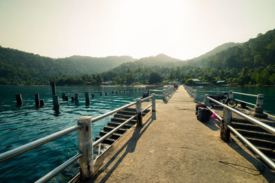 Pier over lake against sky