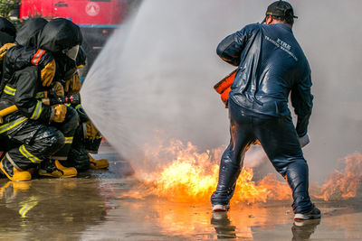 Firefighters extinguishing fire