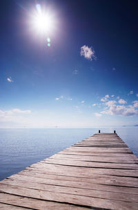 Pier over sea against sky