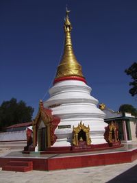 Low angle view of pagoda against blue sky